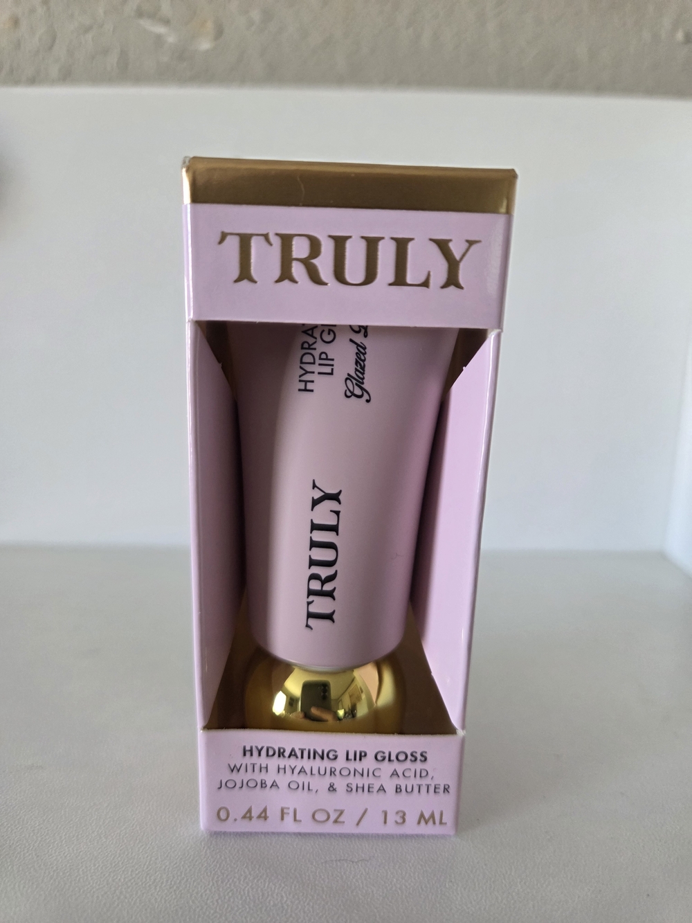 TRULY Hydrating Lip Gloss Tube in Light Pink with Gold Accent